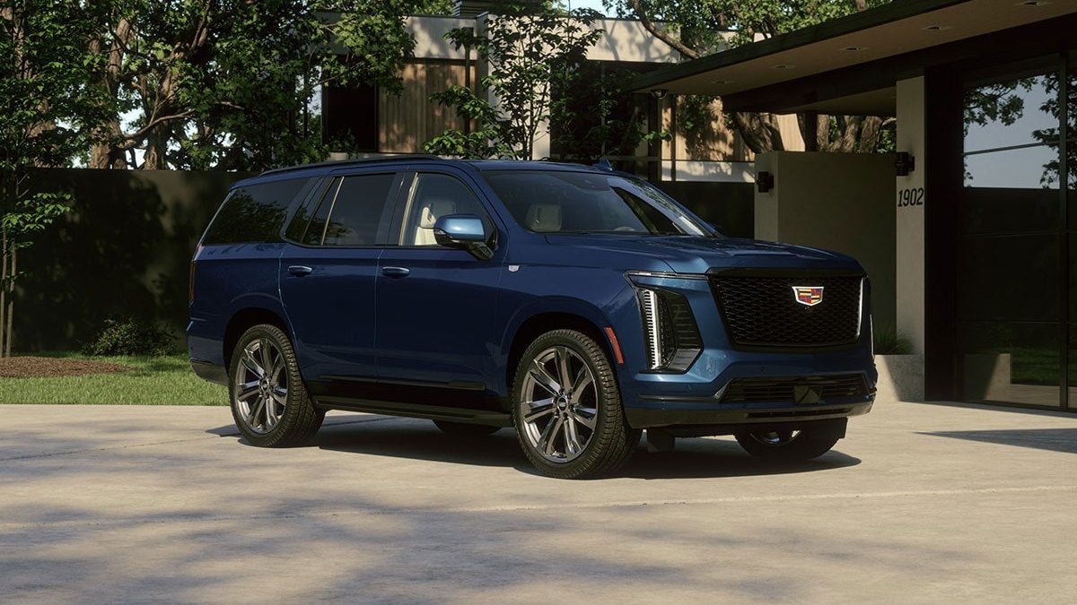 Cadillac Escalade full-size luxury SUV parked in a driveway